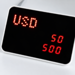 An external display for the cash counting machine displays the currency category and the amount in US dollars